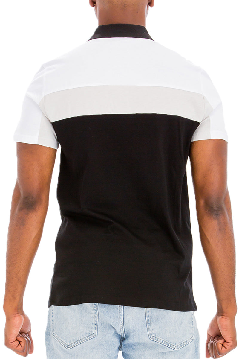 Back view of TADAJ Heritage Polo Shirt in black and white, displaying its clean lines and heritage-inspired color blocking.