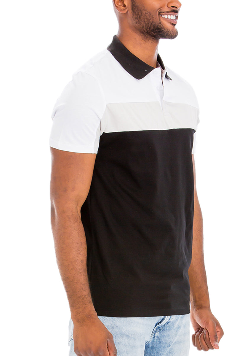 TADAJ Heritage Polo Shirt in black and white from a side angle, emphasizing its structured collar and modern silhouette.